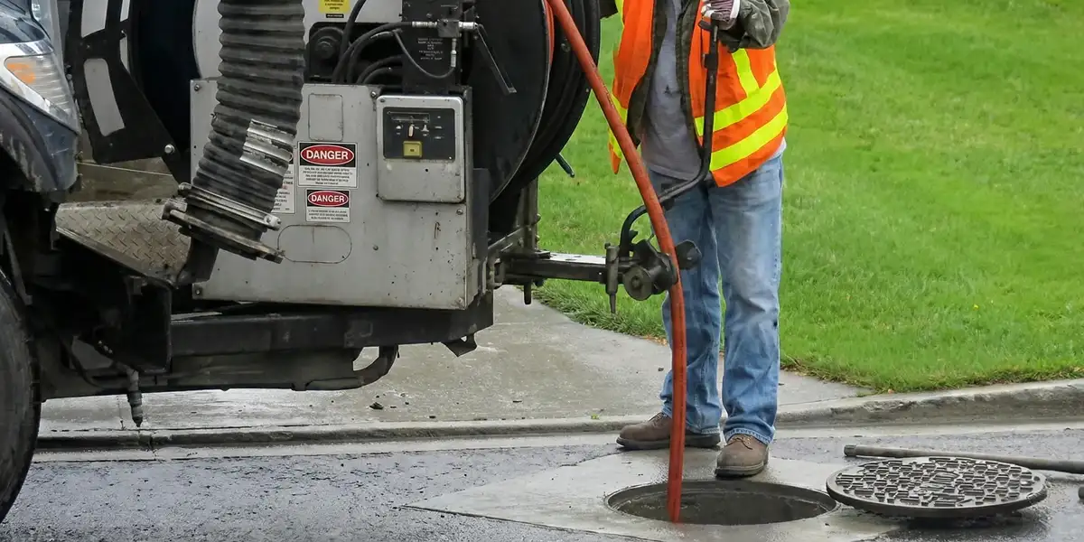 sewage clean up professionals using industrial equipment to remove contaminated wastewater in Raleigh, NC
