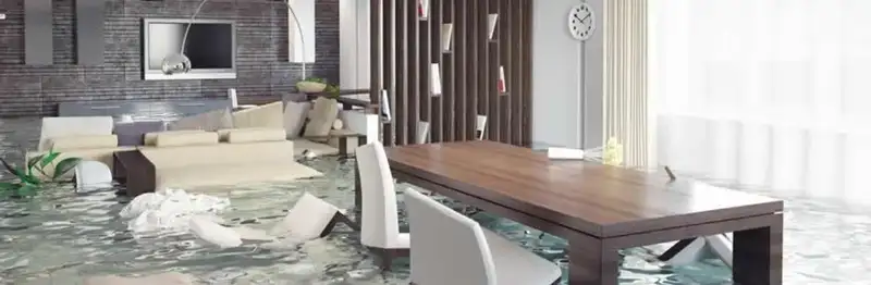 home interior affected by water damage with flooded floors and displaced furniture in Raleigh, NC